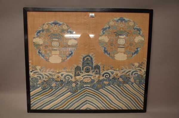 A Chinese embroidered panel from a robe, 19th century, worked with two roundel's of bats and flowers framing Buddhist emblems above rocks and waves, 6