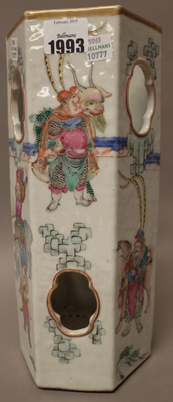 A Chinese famille-rose hexagonal hat stand, 19th century, the pierced sides  painted with figures with animals and mythical beasts, 29cm. high.