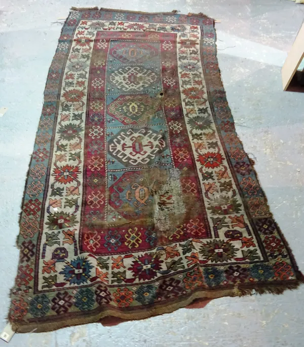 A Kazak rug, 295cm x 148cm.