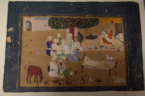 An Indian miniature, 18th/19th century, opaque pigments on card, painted with a group of men seated at leisure and observing a young woman preparing f