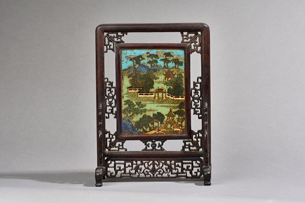 A pair of Chinese cloisonné rectangular table screens, probably 18th century, each decorated in coloured enamels with a landscape with pavilions, a br