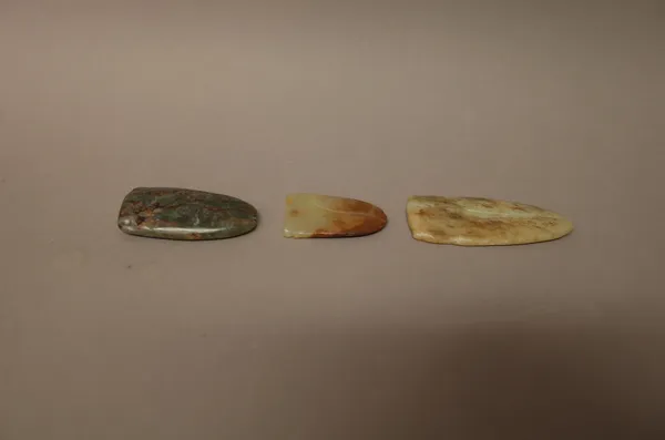 Property from a distinguished UK scholar and collector ( lots 2061-2102).A group of three Chinese jade cicada, probably Han dynasty, of various tones,