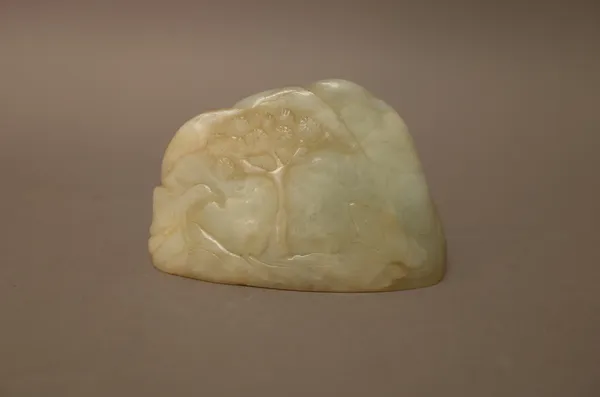 A Chinese pale celadon jade boulder carving, carved with a bird and animal beneath a pine tree, the reverse carved with a tree, 8cm. wide.