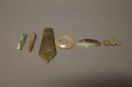 A group of 6 Chinese archaic jade carvings ,including; a hare pendant; a fish pendant; a small circular disc; a pendant, gilt and carved with a taotie