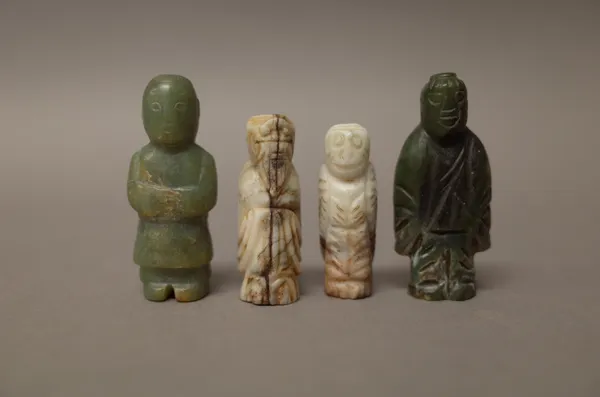 Four Chinese jade small figurative carvings, possibly Han dynasty or later, each carved standing, various colour tones, tallest 5cm. high, (4).