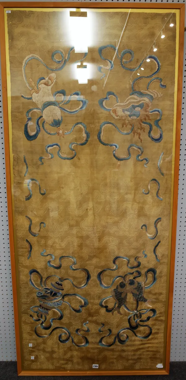 A large Chinese silk-embroidered panel, 18th/19th century, embroidered with four Buddhist emblems on a gold brocade ground, 186cm. by 80cm., framed an