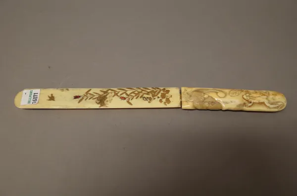 A Japanese Shibayama type ivory page turner, Meiji period, the handle carved with a tree shrew and toad, the blade gilt and inlaid with insects amongs