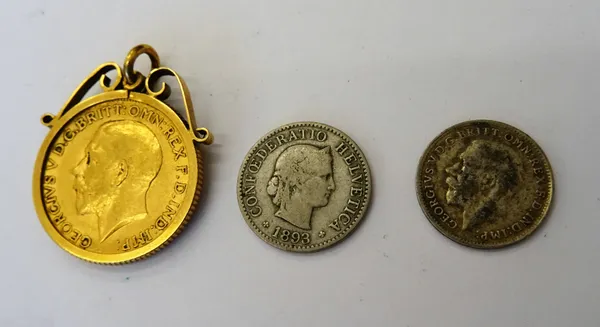 A George V sovereign 1911, in a pendant mount, a silver threepence 1919 and a Swiss five centimes 1893, (3).