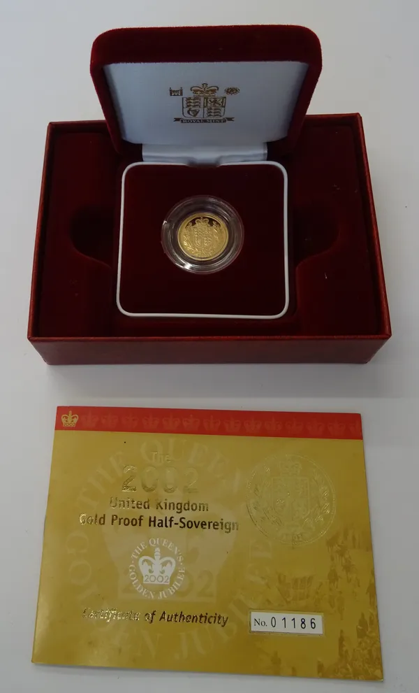 An Elizabeth II gold proof half sovereign, with a shield reverse 2002, with a Royal Mint numbered certificate, case and box.