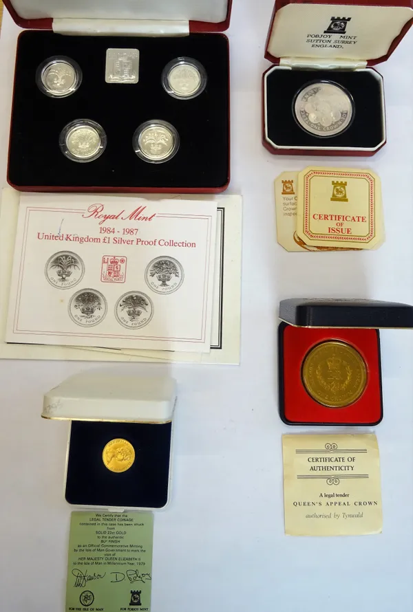 An Isle of Man gold coin 1979, weight 4 gms, a set of four United Kingdom silver proof one pound coins, an Isle of Man silver proof crown 1979 and an
