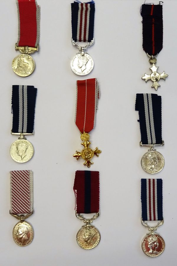 A collection of nineteen dress miniature medals, mostly Second World War, including some gallantry awards, displayed in two plastic sheets and a quant