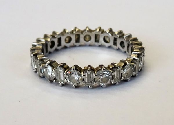 A diamond set full eternity ring, mounted with alternating circular cut diamonds and baguette diamonds, ring size P.