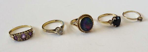 A 9ct gold and diamond set single stone ring, a 9ct gold ring, mounted with an oval opal doublet, a 9ct gold, amethyst and diamond set ring, a 9ct gol