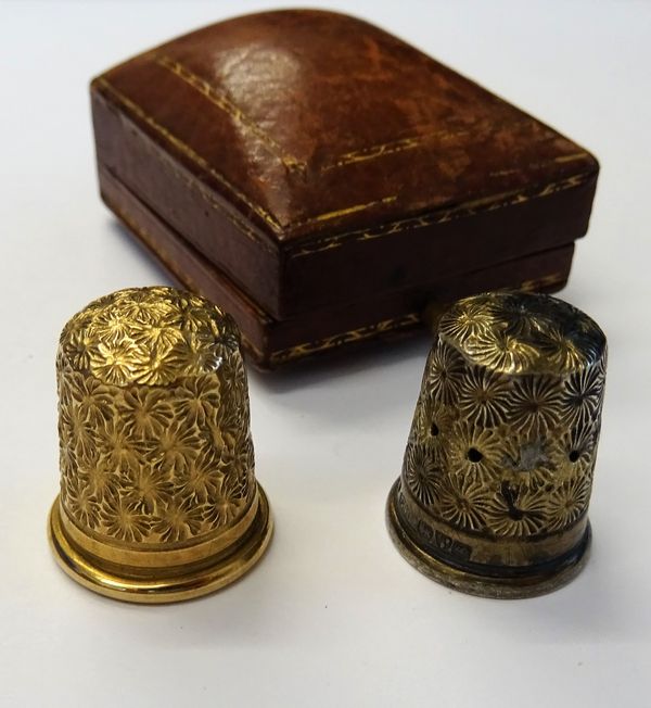 A gold thimble, detailed 9CT, weight 6.5 gms, with a case and a silver thimble by Charles Horner, Chester 1927 (2).