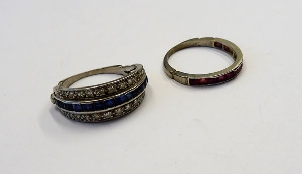 A sapphire and diamond part eternity ring, mounted with a row of calibre cut sapphires to the centre, between two rows of circular cut diamonds, ring