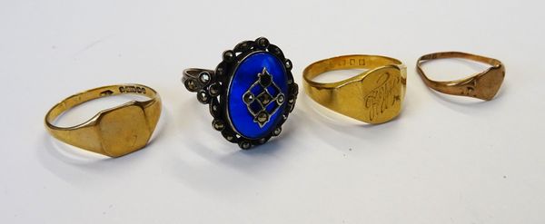 An 18ct gold signet ring, London 1932, ring size Q, weight 4.1 gms, two 9ct signet rings, combined weight 2.6 gms and a marcasite ring. (4)