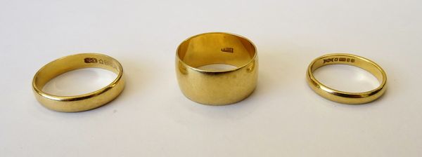 A gold wide band wedding ring, detailed 18 CT, an 18ct gold wedding ring and a gold wedding ring, detailed 750 Bridal, combined gross weight 10.8 gms,