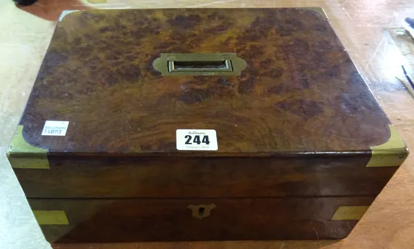 A 19th century walnut and brass bound box with fitted interior, 30cm wide x 14cm high.