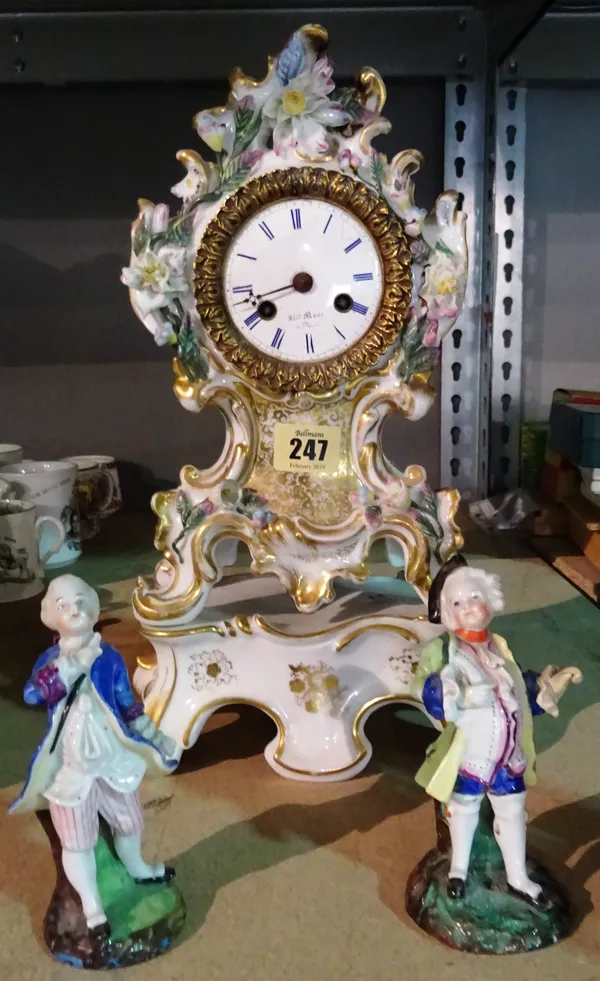 A late 19th century porcelain clock and stand, 38cm high.