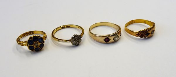 A gold and platinum, diamond set seven stone cluster ring, detailed 18CT PLAT, a gold, diamond and ruby set three stone gypsy ring, a Victorian 15ct g