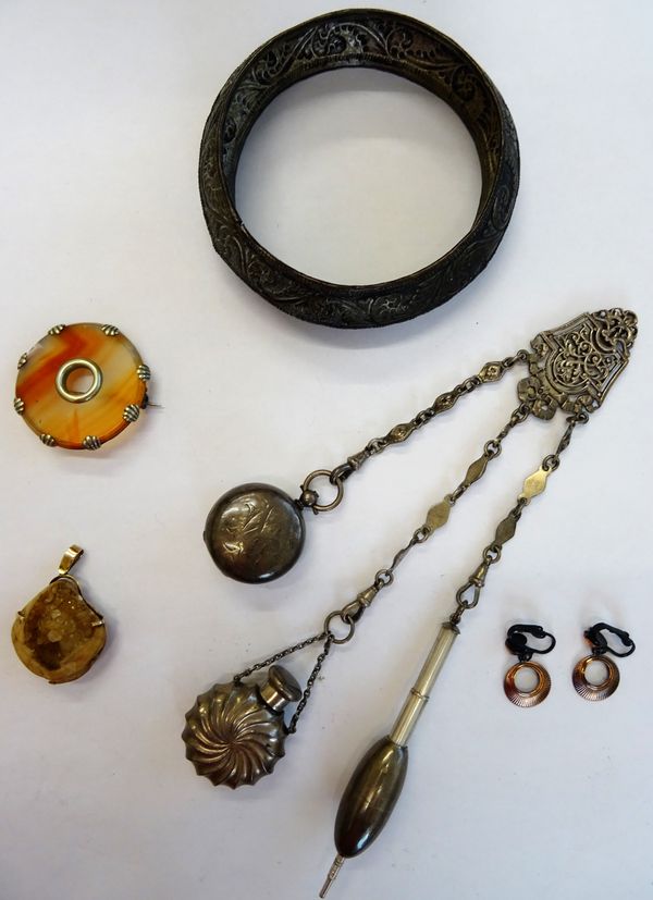 A Victorian agate brooch, of circular form, a native quartz pendant, a pair of costume earrings, an Eastern bangle and a Victorian silver chatelaine,