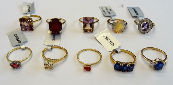 A group of ten 9ct gold and variously gem set rings, in a variety of designs, gross combined weight 26 gms, (10).