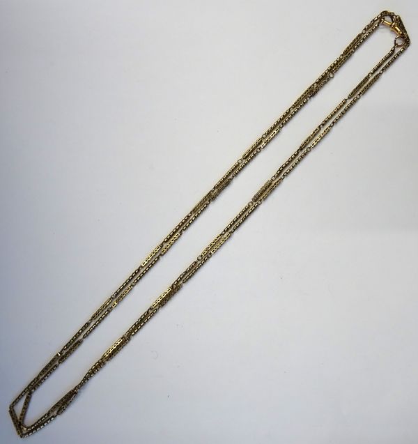 A Victorian gold long guard chain, in a pierced bar and serpentine link design, fitted with a 9ct gold later swivel, length excluding swivel 132cm, we