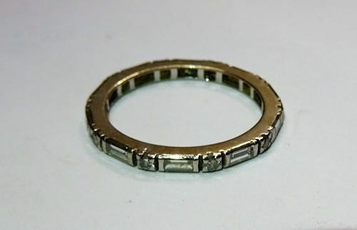 A platinum and diamond set full eternity ring, mounted with alternating baguette and circular cut diamonds, ring size N.
