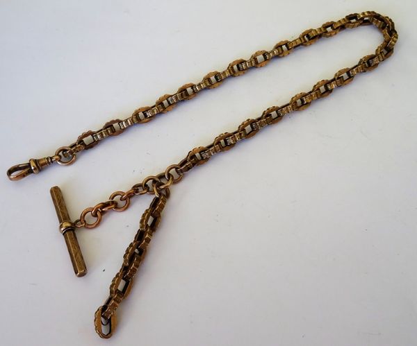 A Victorian gold watch Albert chain, in a decorated oval link design, detailed 9 C, fitted with a gold swivel detailed 9 CT and with a hexagonal T bar