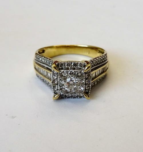 A gold and diamond square cluster ring, mounted with the principal circular cut diamond to the centre, in a two tier surround, set with circular cut d