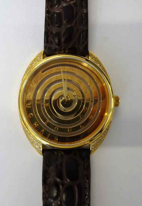 A Zoughaib gilt metal cased and diamond set gentleman's wristwatch, with a quartz movement, the signed spiral dial with gilt hands and diamond set cor