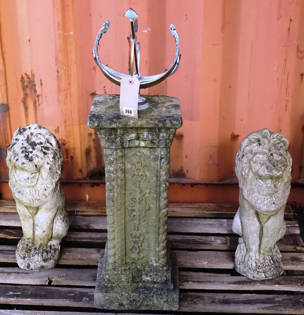 Garden statuary, comprising; a pair of reconstituted stone  figures, of lions, 50cm high and a reconstituted stone sun dial, 85cm high, (2).