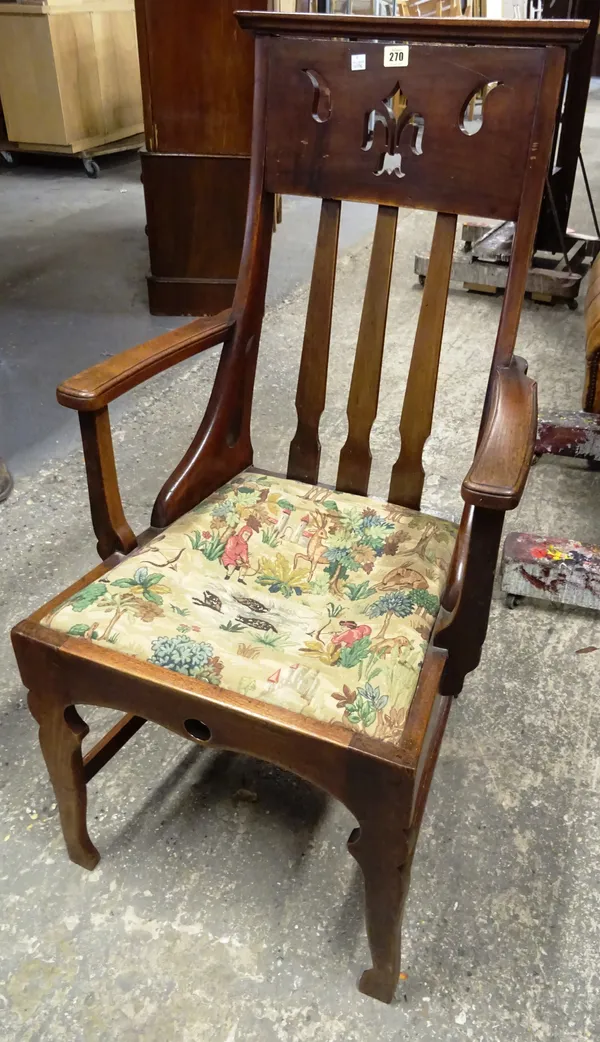 A late Victorian rosewood prie dieu, stamped to frame and a late Victorian mahogany open armchair (2).