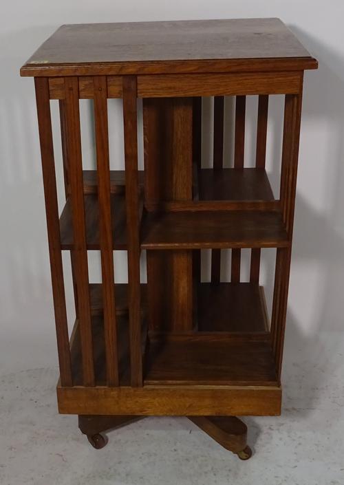 An early 20th century oak revolving bookcase, 54cm wide x 96cm high.
