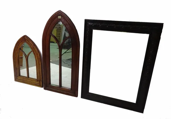A Gothic style oak arch top wall mirror, 48cm wide x 100cm high, another smaller, 48cm wide x 70cm high and a rectangular oak framed wall mirror, 72cm