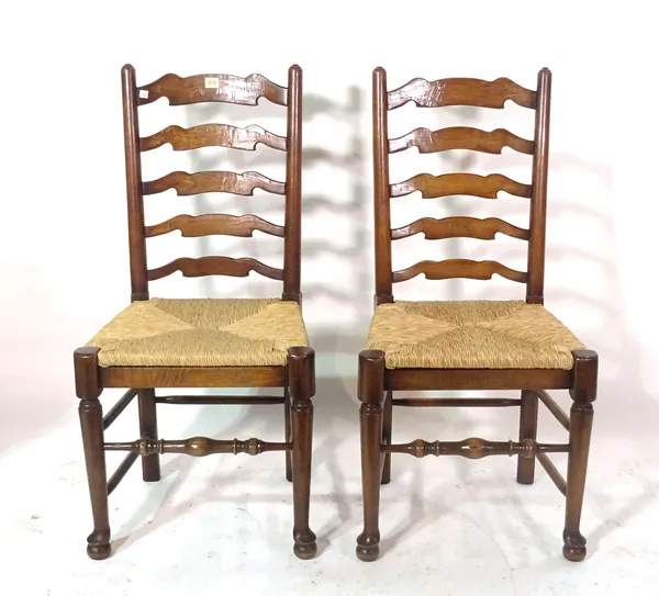 A set of eight 18th century style oak ladder back dining chairs and a 19th century walnut chair, (9).