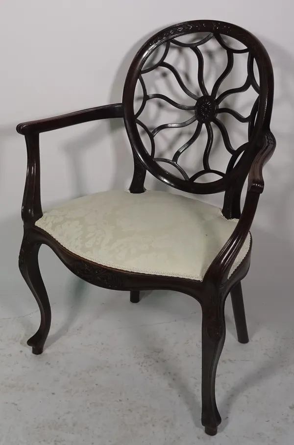 An early 20th century mahogany spiderweb back open armchair on cabriole supports, 69cm wide x 91cm high.