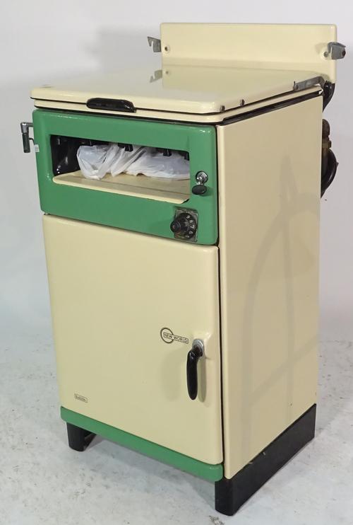 A mid-20th century New World cream gas cooker, 52cm wide and an oval metal bucket, (2). Sold as seen