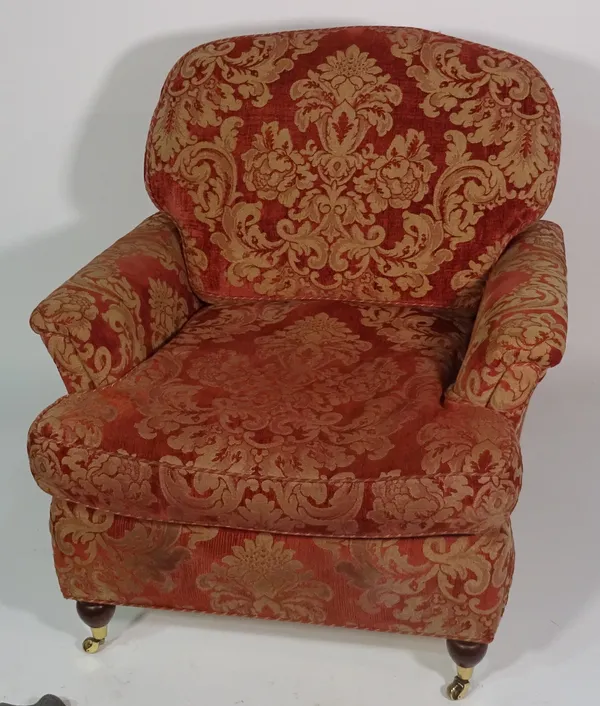 A 20th century red and gold upholstered three seater sofa, 208cm wide x 89cm high and two matching armchairs, 74cm wide x 88cm high (3).