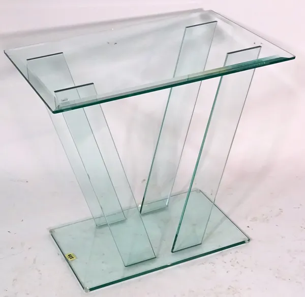 A 20th century glass side table on outswept supports on plinth base, 68cm wide x 64cm high.