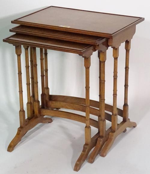 A nest of three Regency style occasional tables, the larger 53cm wide x 57cm high, together with a late 19th century French parcel gilt walnut balloon