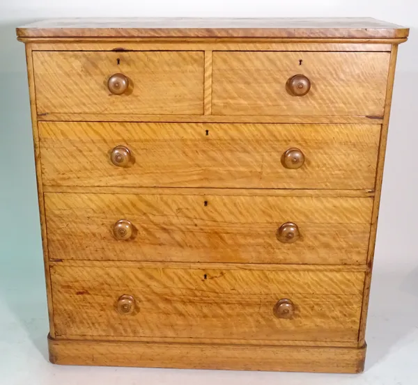 A 19th century satin birch chest of two short and three long drawers on plinth base, 107cm wide x 107cm high.