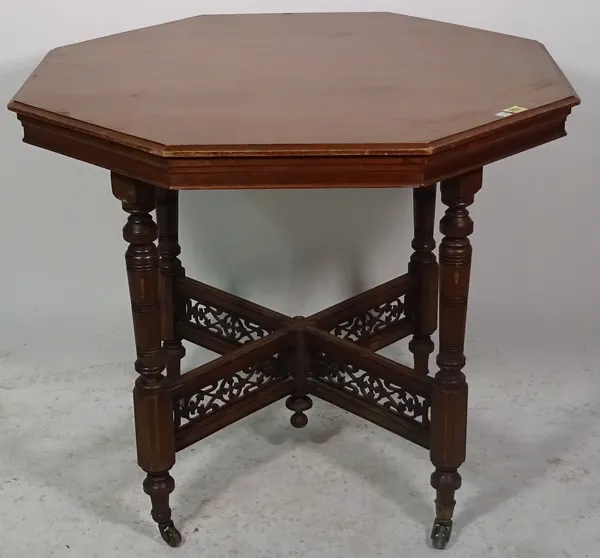 A late 19th century walnut octagonal occasional table, on turned supports, united by pierced stretcher, 84cm wide x 73cm high.