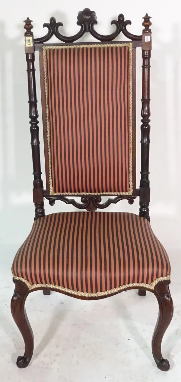 A Victorian rosewood hall chair on scroll supports.