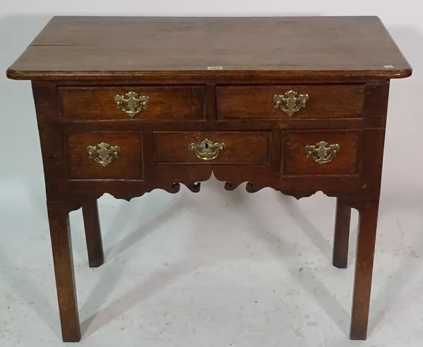 A George III oak lowboy on square supports, 86cm wide x 71cm high.