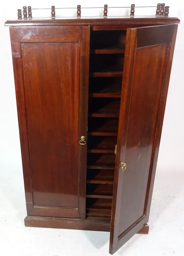 A 20th century mahogany two door side cabinet with galleried top, 80cm wide x 128cm high.