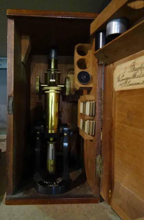 J. Swift & Son, a 20th century mahogany cased microscope, 17cm wide x 33cm high.