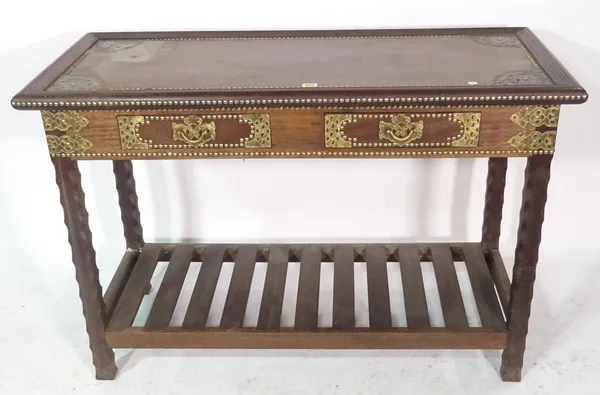 A 20th century African hardwood and brass studded two drawer side table, 117cm wide x 77cm high.