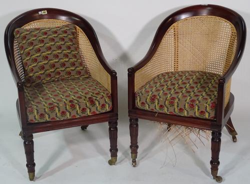 A pair of William IV style tub back library bergeres on lappet supports, 53cm wide 86cm high (2).