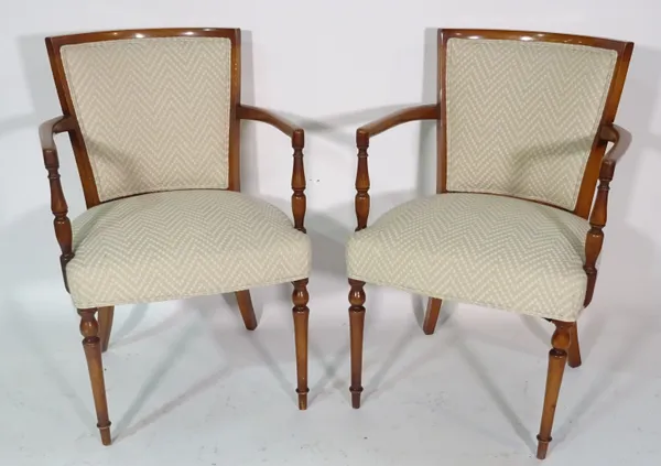 A set of four mahogany framed open armchairs on turned supports, 58cm wide x 87cm high (4).
